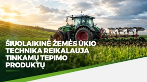 Žalias traktorius, ariantis lauką po debesuotu dangumi, demonstruojantis modernias ūkininkavimo technologijas.